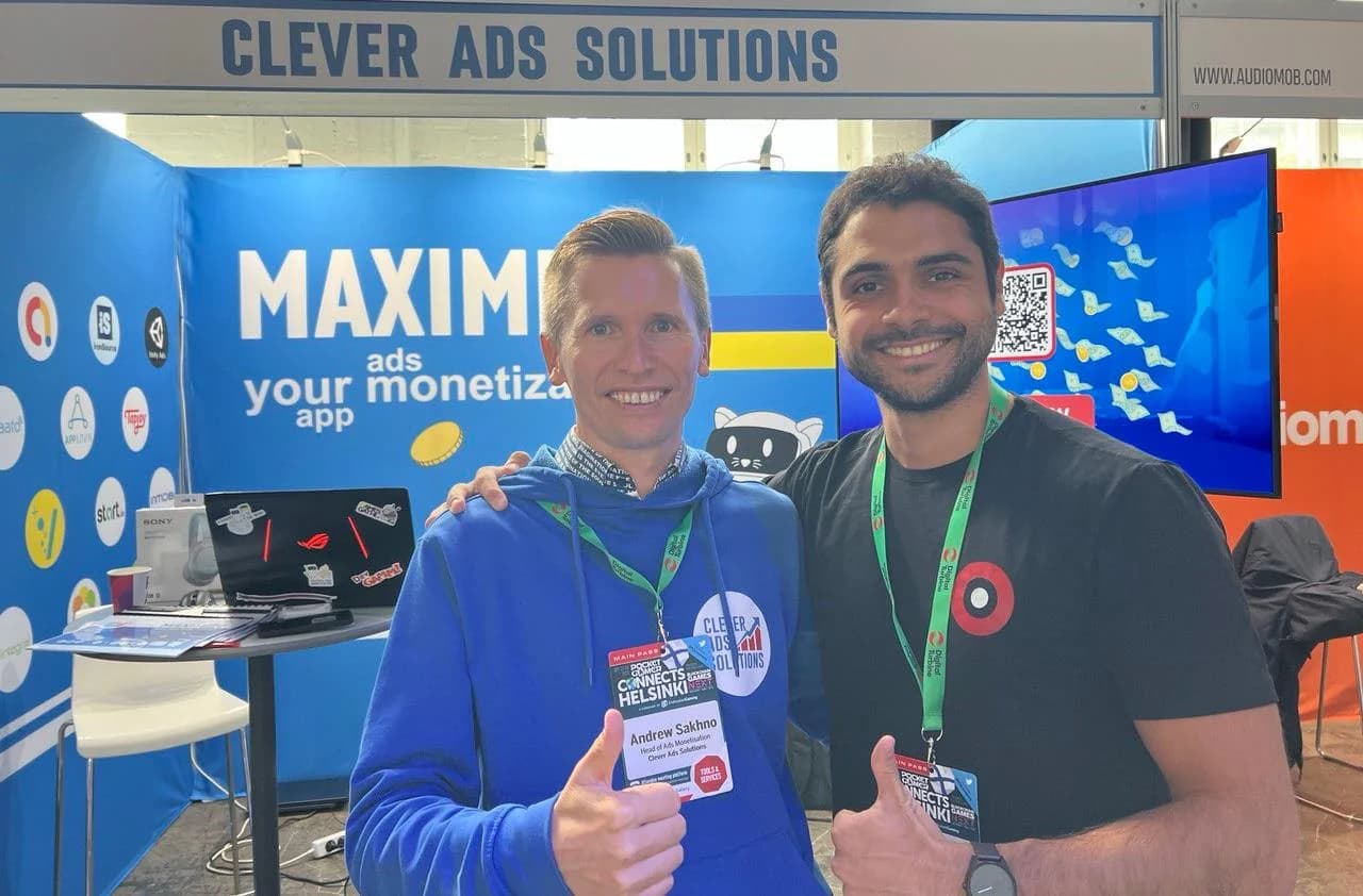 Andrew with a conference organiser at the CAS stand at Pocket Gamer Connects Helsinki, both giving a thumbs up